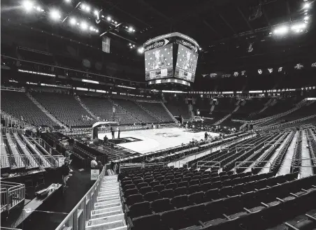  ?? Ed Zurga / Getty Images ?? Stadiums, such as the Sprint Center in Kansas City, Mo., site of the Big 12 tournament, suddenly were emptied because of the virus.