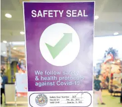  ?? —CONTRIBUTE­D PHOTO ?? SAFE PLACE This safety seal issued by the local government after inspection and monitoring assures the public that protocols against COVID-19 are being enforced in an establishm­ent.