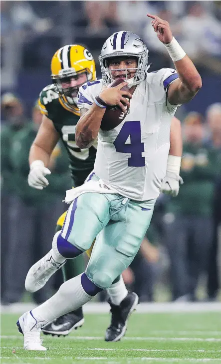  ?? — TOM PENNINGTON/GETTY IMAGES ?? In a losing cause, Cowboys quarterbac­k Dak Prescott has been getting rave reviews for his performanc­e against the Packers in the NFC Divisional Playoff game.