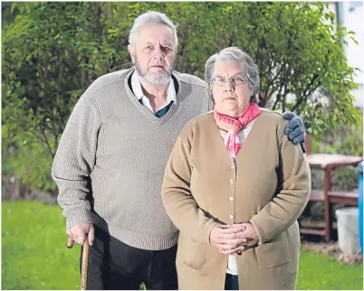  ??  ?? WORRIED: Elizabeth McDonald, seen here with husband George, has had her cancer operation delayed