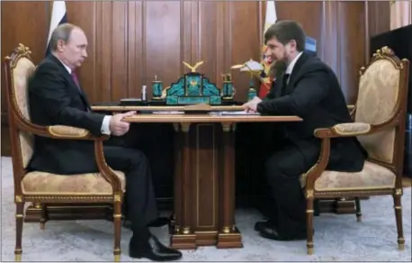  ?? MIKHAIL KLIMENTYEV, SPUTNIK, KREMLIN POOL PHOTO VIA AP, FILE ?? In this file photo taken on Friday Russian President Vladimir Putin, left, meets with Chechen regional leader Ramzan Kadyrov in the Kremlin in Moscow, Russia.