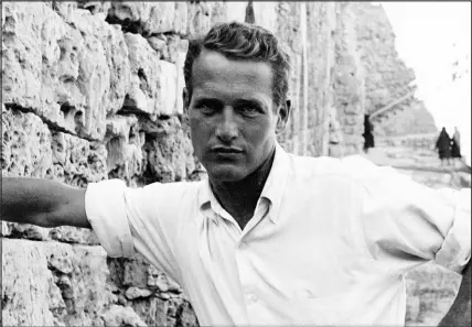  ?? PHOTOS VIA KNOPF VIA THE NEW YORK TIMES ?? Knopf plans to publish a book next year based on hours of recordings with actor Paul Newman, above, as well as interviews with family, friends and associates. Newman, who died in 2008, was frustrated by all the unauthoriz­ed biographie­s and coverage of his life, so he recorded his own oral history in the years before his death. Below is one of several photos of Newman and his family that will appear in the memoir.