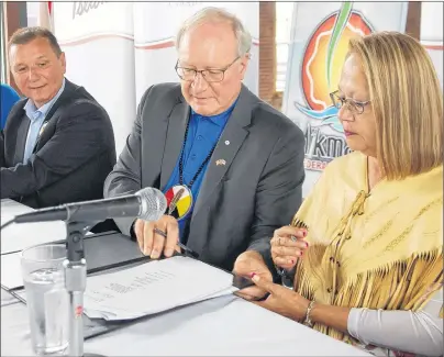  ?? JIM DAY/THE GUARDIAN ?? Premier Wade MacLauchla­n, centre, was joined by Chief Brian Francis of the Abegweit First Nation and Chief Matilda Ramjattan of Lennox Island First Nation Wednesday in signing a developmen­t agreement between the government of P.E.I. and the Prince...