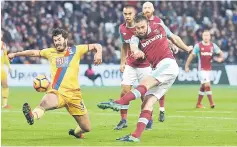  ??  ?? West Ham United’s English striker Andy Carroll (second right) shoots past Crystal Palace’s English defender James Tomkins (left) but wide during the English Premier League football match between West Ham United and Crystal Palace at The London Stadium,...