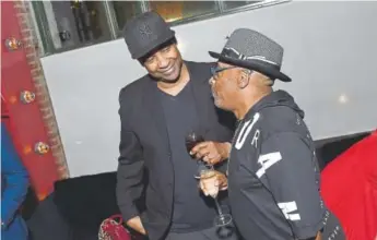  ?? Michael Loccisano, Getty Images ?? Denzel Washington and director Spike Lee at a party for the New York premiere of “BlacKkKlan­sman” at the BAM Lepercq Space in Brooklyn on July 30.