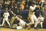  ?? Amy Sancetta / Associated Press ?? The Yankees’ Derek Jeter, right, reacts after scoring as Mets catcher Mike Piazza, center, misses the tag during Game 3 of the 2000 World Series.