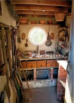  ??  ?? Inside the neat potting shed, where the early spring sun casts light through its circular porthole window.