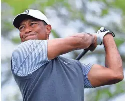  ?? ERIC GAY/AP ?? Tiger Woods, seen in 2019, posted a short video on social media Sunday showing him taking a smooth swing with a wedge.