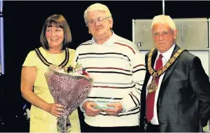  ??  ?? John Timms, aged 76, of Runcorn is a Health Walks Leader ,was presented with Volunteer Of The Year by the mayor Ged Philbin.