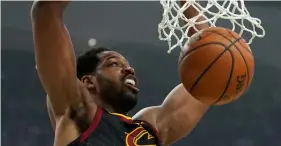  ??  ?? Cleveland Cavaliers’ Tristan Thompson dunks during the first half of an NBA basketball game against the Milwaukee Bucks on Monday, in Milwaukee. AP Photo/Morry GAsh