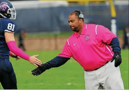  ?? DFM FILE PHOTO ?? Former Pottstown head coach Don Grinstead, right, was approved to become Phoenixvil­le’s next head football coach Thursday night.