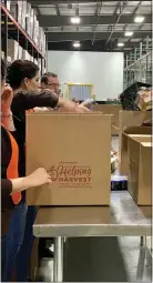  ?? COURTESY OF DUNKIN’ BRANDS ?? Representa­tives of area Dunkin’ coffee and doughnut shops volunteere­d Thursday at Helping Harvest Food Bank in Spring Township. The food bank serves more than 100,000 people in Berks and Schuylkill counties