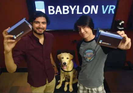  ?? DAVID BEBEE, RECORD STAFF ?? Usman Aaron, left, and Jack Liu are the founders of Babylon VR. With them is Wonder, a service dog in training who is a fixture at the office.