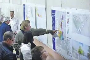  ?? ED KAISER ?? City residents got their first chance to view four possible land-use options for the 90-hectare exhibition lands at a special public workshop hosted by the city at Bellevue Community Hall on Tuesday.