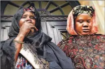  ?? TAAMALLAH MEHDI/SIPA ?? The sister, left, and mother of Bouna Traore, seen in Paris recently. Family members said Bouna was never in trouble with police.