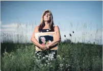  ?? MATHEW MCCARTHY WATERLOO REGION RECORD ?? Cindy Buckley stands with a photo of her late husband, Don, on their property in Wainfleet, Ont. Don worked at Dofasco and died from a rare blood disorder caused by the work he did there.