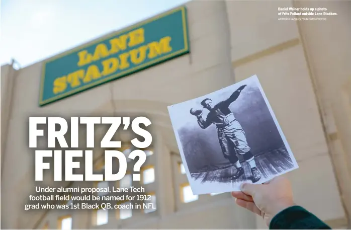  ?? ANTHONY VAZQUEZ/SUN-TIMES PHOTOS ?? Daniel Weiner holds up a photo of Fritz Pollard outside Lane Stadium.
