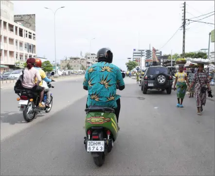  ?? Photo: Nampa/AFP ?? Smooth ride… Eraste Padonou, a biker, rides his electric motorcycle from M Auto on the roads of Cotonou.