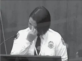  ?? COURT TV VIA AP, POOL ?? In this image from video, Minneapoli­s firefighte­r Genevieve Hansen wipes her eyes as she testifies Tuesday in the trial of former Minneapoli­s police Officer Derek Chauvin.