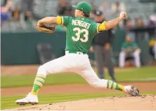  ?? Thearon W. Henderson / Getty Images ?? A’s starter Daniel Mengden made 99 pitches with lots of traffic on the bases, but only gave up one run in four innings.