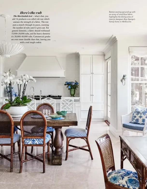  ?? ?? Rattan seating spruced up with an array of vivid blue fabric highlights the dining area of interior designer Amy Spargo’s family home in Melbourne.