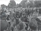  ??  ?? Protesters and police converge in Wauwatosa on Friday evening.