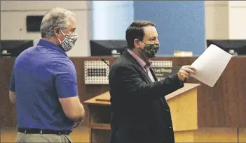  ?? Buy these photos at YumaSun.com
PHOTOS BY RANDY HOEFT/YUMA SUN ?? YUMA MAYOR DOUG NICHOLLS (RIGHT) AND DR. ROBERT TRENSCHEL, Yuma Regional Medical Center President and CEO, wear protective masks at the June 18 special Yuma City Council meeting inside the council chambers at One City Plaza.