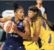  ?? Chris O’Meara / Associated Press ?? The Sun’s Alyssa Thomas, left, drives against the Sparks’ Seimone Augustus on Thursday.