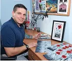  ?? Royal Navy ?? Petty Officer Scott Falkiner at work on his poppy artwork in his cabin at HMS Raleigh