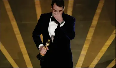  ?? CHRIS PIZZELLO THE ASSOCIATED PRESS ?? James Friend accepts the award for best cinematogr­aphy for “All Quiet on the Western Front” at the Academy Awards on Sunday at the Dolby Theatre in Hollywood.