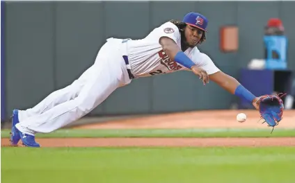  ?? NATHAN DENETTE/AP ?? Bisons manager Bobby Meacham says of the third-base play of Vladimir Guerrero Jr.: “I see his footwork and how he moves to make the plays and his arm strength, and there is no doubt he can play third base. He is moving better than guys smaller than him.”