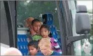  ??  ?? Children from New York City and the Fresh Air Fund make their way off the bus at Aqua Vino in Utica on Thursday, Aug. 16, 2018.