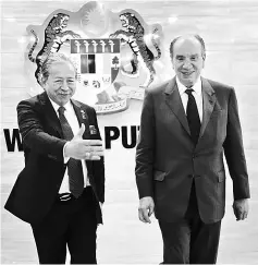  ??  ?? Anifah (left) receives a courtesy call from Nunes at his office in Wisma Putra. — Bernama photo