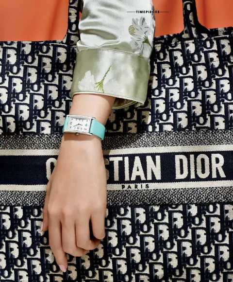  ??  ?? Tiffany East West 37mm Watch ($4,900) by Tiffany & Co.; tote by Christian Dior; jacket by Ganni; nails: UnLocked by CND Shellac. RIGHT Oyster Perpetual Day-Date 36mm ($27,050) by Rolex; tote by Louis Vuitton; dress by Emporio Armani; nails: Sun...