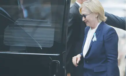  ??  ?? HILLARY CLINTON climbs into a van in New York City on Sunday after recovering from a fall outside a 9/11 memorial ceremony.