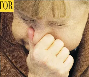  ?? ODD ANDERSEN / AFP / GETTY IMAGES ?? German Chancellor Angela Merkel stifles a sneeze in Berlin in 2011. But don’t try this yourself — a British man who did so ended up in hospital after he ruptured his throat holding back a sneeze.