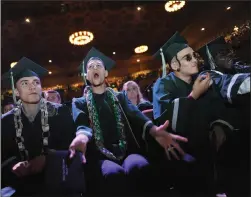  ??  ?? Graduate Jayden Baroni cheers during Thursday’s commenceme­nt ceremony.