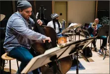  ?? (The New York Times/Gabriela Bhaskar) ?? Carlos Henriquez, Obed Calvaire and Wynton Marsalis rehearse ahead of the “Wynton at 60” program in New York.