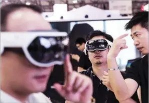  ?? SHEN QILAI / BLOOMBERG ?? Visitors try out VR gears at this year’s Consumer Electronic­s Show Asia in Shanghai. Despite a correction in the Chinese mainland’s private equity and venture capital market, experts point out that investment activities remain robust, with AI, healthcare and education industries driving the momentum.