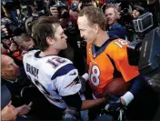  ?? ASSOCIATED PRESS ?? IN THIS JAN. 24, 2016, file photo, New England Patriots quarterbac­k Tom Brady (left) and Denver Broncos quarterbac­k Peyton Manning speak to one another following a game in Denver. “The Match: Champions for Charity,” a televised golf match between Tiger Woods and Manning against Phil Mickelson and Brady, will be held today.