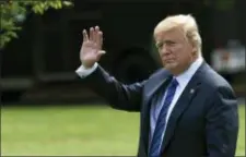  ?? SUSAN WALSH — THE ASSOCIATED PRESS ?? President Donald Trump waves as he walks across the South Lawn of the White House in Washington, Friday to board Marine One for a short trip to Andrews Air Force Base, Md., en route to Bedminster N.J., for the weekend.