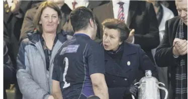  ??  ?? 2 Princess Anne shares a few words with Stuart Mcinally as she prepares to present the Scotland skipper with the Calcutta Cup following a stunning comeback against England. SRU president Dee Bradbury, left, looks on with pride.