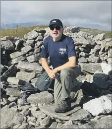  ??  ?? HEAD FOR HEIGHTS Rob Moriarty at the summit of Ben Chonzie