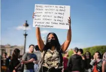  ?? Lewis Joly/Associated Press ?? Youths gather on Concorde Square during a protest Friday in Paris in response to a fatal police shooting.