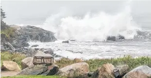  ??  ?? Lynn Winfield watched as Dorian unleashed crashing waves at Sandy Point in Shelburne, N.S., last September.