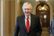  ?? J. SCOTT APPLEWHITE - THE ASSOCIATED PRESS ?? Senate Majority Leader Mitch McConnell, R-Ky., smiles after vote on a hard-won budget deal that would permit the government to resume borrowing to pay all of its obligation­s and would remove the prospect of a government shutdown in October, at the Capitol in Washington, Thursday.