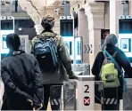  ??  ?? Who’s who: passengers use biometric passports at an automated ePassport gate equipped with a facial recognitio­n system