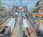  ?? VIJAYANAND GUPTA/HT ?? ▪ A worker at a textile mill in Surat.