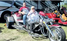  ?? BERND FRANKE/WELLAND TRIBUNE ?? Rob and Sandie Van Brederode ride his and hers Rewaco three-wheeled motorcycle­s that are built in Germany and sell for upwards of $50,000 each.