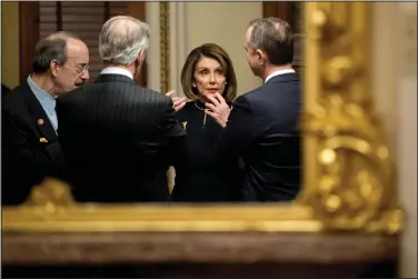  ?? (File photo/AP/Andrew Harnik) ?? House Speaker Nancy Pelosi (center) of California speaks Dec. 18 with House Intelligen­ce Committee Chairman Adam Schiff (right), D-Calif., House Foreign Affairs Committee Chairman Eliot Engel (left), D-N.Y., and House Ways and Means Committee Chairman Richard Neal, D-Mass., in a private room just off the House floor after the House voted to impeach President Donald Trump on Capitol Hill in Washington. Online posts that include this photo have incorrectl­y asserted it shows the lawmakers without masks in mid-July 2020. The photo was taken before the first known case of coronaviru­s was reported in the U.S.